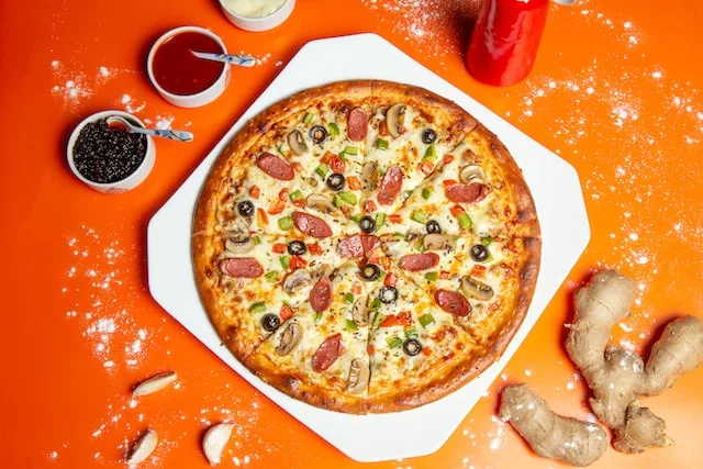 How many Calories does a whole pizza loaded with everything on it have?